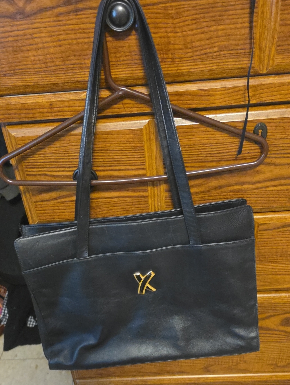 Black Leather Women's Shoulder Bag with Gold Emblem